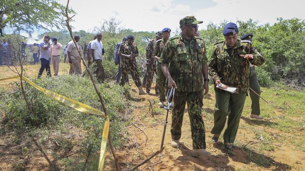 Kenya's Inspector General of Police Japhet Koome, second right, tours the scene where dozens of bodies were found in shallow graves in the village of Shakahola near the coastal city of Malindi, in southern Kenya Monday, April 24, 2023. - Sputnik Africa