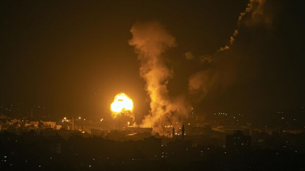 Fire and smoke rise following an Israeli airstrike in northern Gaza Strip, late Tuesday, May 2, 2023. The Israeli military said it had started airstrikes on Gaza targets, in response to earlier rocket salvos from the coastal strip, run by the militant Hamas group. - Sputnik Africa