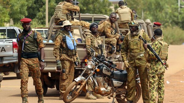 Soldiers loyal to Burkina Faso's latest coup leader Capt. Ibrahim Traore gather outside the National Assembly as Traore was appointed Burkina Faso's transitional president in Ouagadougou, Burkina Faso, Friday Oct. 14, 2022.  - Sputnik Africa