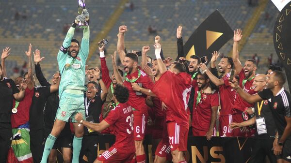 Al Ahly players celebrate with the trophy after winning the CAF Champions League final soccer match between Morocco's Wydad Athletic Club and Egypt's Al Ahly SC, at the Mohammed V stadium, in Casablanca, Morocco, Sunday, June 11, 2023 - Sputnik Africa