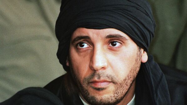 Hannibal Gadhafi, son of ousted Libyan leader Moammar Gadhafi, watches an elite military unit exercise in Zlitan, Libya, Sept. 25, 2011. Hannibal Gadhafi who has been held in Lebanon for more than seven years began a hunger strike Saturday, June 3, 2023, to protest his detention without trial, his lawyer said.  - Sputnik Africa