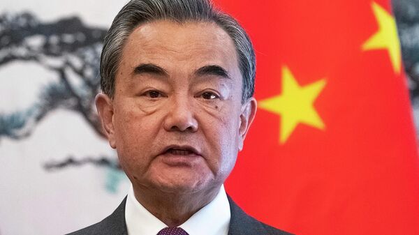 Chinese Foreign Minister Wang Yi speaks during a joint press conference with Serbian Foreign Minister Ivica Dacic following their meeting at Diaoyutai State Guesthouse in Beijing on Feb. 26, 2020. China on Wednesday, July 5, 2023, dismissed criticism of racially tinged comments by its top diplomat, who said Europeans and Americans are incapable of distinguishing among Chinese, Koreans and Japanese - Sputnik Africa