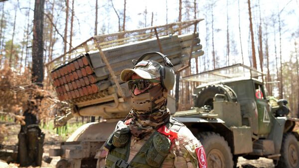 Serviceman of the Central unit near the BM-21 Grad multiple launch rocket system in the Krasnolimansk direction, LPR.  - Sputnik Africa