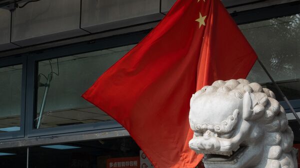 A view shows Chinese national flags in a street of an old neighbourhood as the city prepares for the 20th National Congress of the Communist Party of China, in Beijing - Sputnik Africa