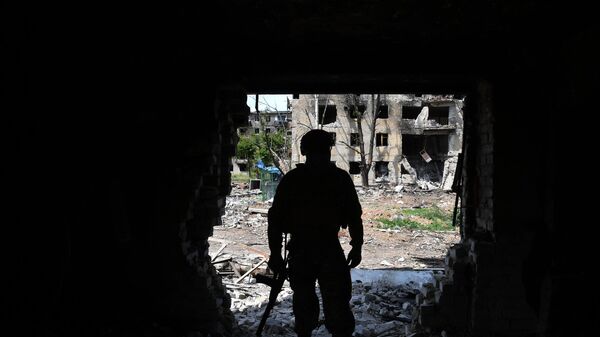 A Russian serviceman of the 150th motorized rifle division of the Southern Group of Forces patrols an area, in the course of Russia's military operation in Ukraine, in the town of Artemovsk, also known as Bakhmut, Donetsk People's Republic, Russia. - Sputnik Africa