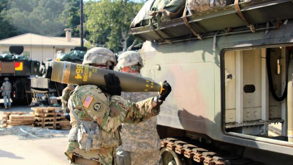 Soldiers from Alpha Battery, 1st Battalion, 82nd Field Artillery Regiment, 1st Armored Brigade Combat Team, 1st Cavalry Division, participate in a load exercise directed by the 210th Field Artillery Brigade, 2nd Infantry Division Sept. 20. They transported and loaded nearly 100 rounds during the exercise. Pictured: A Soldier carries a 155mm Base Burn Dual Purpose Improved Conventional Munition round, weighing more than 100 pounds, to a M992 Field Artillery Support Vehicle during the exercise. - Sputnik Africa