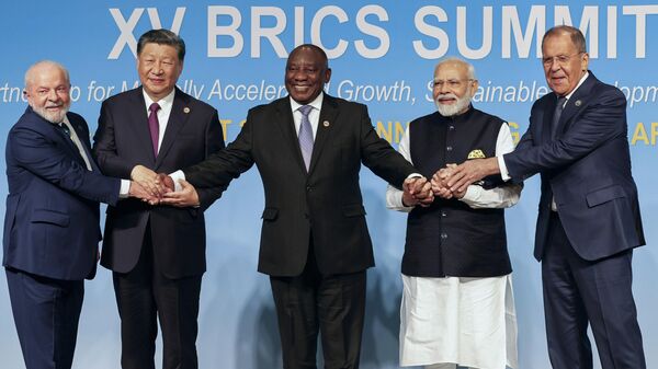 From left, Brazil's President Luiz Inacio Lula da Silva, China's President Xi Jinping, South Africa's President Cyril Ramaphosa, India's Prime Minister Narendra Modi and Russia's Foreign Minister Sergei Lavrov pose for a BRICS group photo during the 2023 BRICS Summit at the Sandton Convention Centre in Johannesburg, South Africa, Wednesday, Aug. 23, 2023. - Sputnik Africa