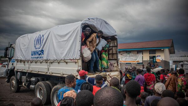 Internally displaced people get off from a United Nations High Commissioner for Refugees (UNHCR) truck in Kanyaruchinya on November 11, 2022 after fleeing conflict between the Armed Forces of the Democratic Republic of the Congo (FARDC) and M23 (March 23 Movement) in the territory of Rutsuru in the DRC.  - Sputnik Africa