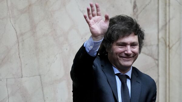 President-elect Javier Milei waves during a joint session of Congress to officially declare him and his running mate winners of the presidential runoff election, in Buenos Aires, Argentina, Wednesday, Nov. 29, 2023. - Sputnik Africa