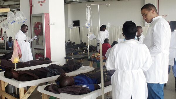 Doctors care for patients affected by Cholera at the Heroes stadium temporary transformed in a hospital on January 15, 2018 in Lusaka, Zambia.  - Sputnik Africa