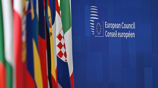 This photograph taken on December 15, 2023, shows lined up flags at the European headquarters during the European Union summit, in Brussels.  - Sputnik Africa