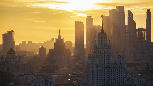 A view shows the Christ the Saviour Cathedral, Russian Foreign Ministry headquarters, a Soviet era high-rise building on Kotelnicheskaya Embankment and the skyscrapers of the Moscow International Business Centre, also known as Moskva-City, during sunset in Moscow, Russia. - Sputnik Africa