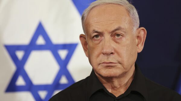 Israeli Prime Minister Benjamin Netanyahu attends a press conference with Defense Minister Yoav Gallant and Cabinet Minister Benny Gantz in the Kirya military base in Tel Aviv, Israel, Saturday, Oct. 28, 2023.  - Sputnik Africa
