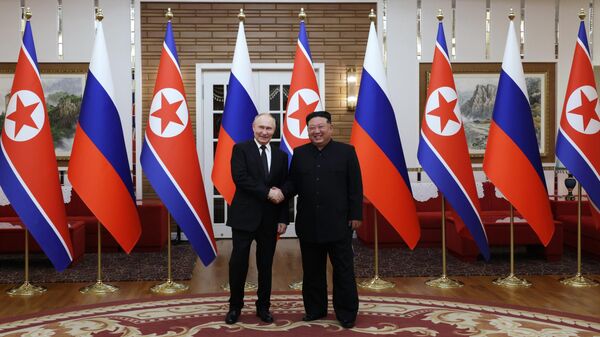 Russian President Vladimir Putin and President of the State Affairs of the Democratic People's Republic of Korea Kim Jong Un (right) during a joint photograph in Pyongyang on June 19, 2024. - Sputnik Africa