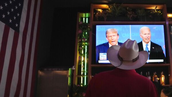 The presidential debate between President Joe Biden and Republican presidential candidate former President Donald Trump at a debate watch party Thursday, June 27, 2024 - Sputnik Africa