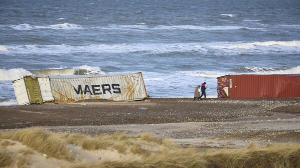 Several containers stranded between Tranum and Slette beach, northern Norway, on December 23, 2023 after being lost in the North Sea during storm Pia. - Sputnik Africa
