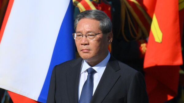 Premier of the State Council of China Li Qiang at a wreath-laying ceremony at the Tomb of the Unknown Soldier in the Alexander Garden in Moscow. - Sputnik Africa
