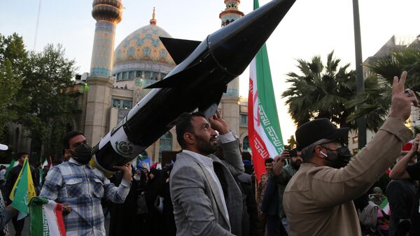 A group gather in Palestine Square in the Iranian capital Tehran, staging a demonstration to support Iran's drone and missile attacks on Israel on April 15, 2024. - Sputnik Africa