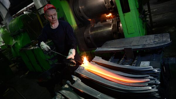 A worker during the production of a hand scythe from tool steel at the Artinsky Plant, the only manufacturer of agricultural scythes in Russia, in Yekaterinburg. - Sputnik Africa