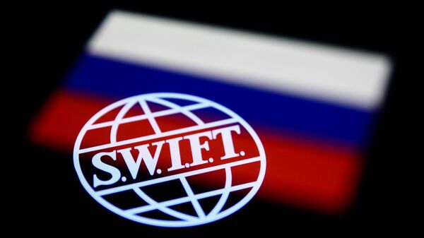 SWIFT (Society for Worldwide Interbank Financial Telecommunication) logo displayed on a phone screen and Russian flag displayed on a phone screen are seen in this multiple exposure illustration photo taken in Krakow, Poland on February 28, 2022. - Sputnik Africa