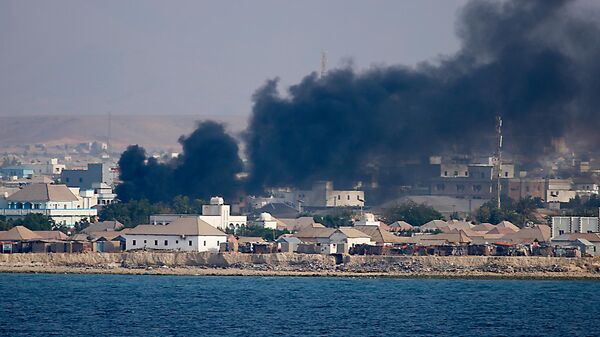 The smoke after bombing in Somalia Bosasso, Puntland, 2019. - Sputnik Africa