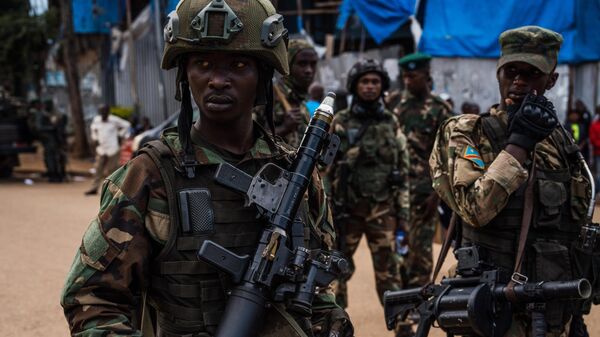 M23 rebels guard a unit of surrendering Congolese police officers who will be recruited into the rebel group on February 22, 2025 in Bukavu, Democratic Republic of Congo. - Sputnik Africa