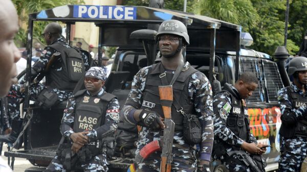 Policemen mount guard as members of Nigeria Labour Congress (NLC) and Trade Union Congress (TUC) and Civil Society Group stage a protest over the hardship facing the mass as a result of the removal of fuel subsidy by the government, in Ikeja, Lagos, Nigeria on Wednesday, August 2, 2023.  - Sputnik Africa