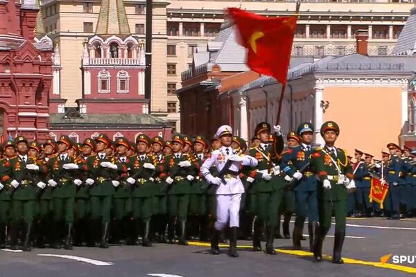Foreign participants in the Victory Day parade march through Red Square Foreign participants in the Victory Day parade march through Red Square - Sputnik Africa