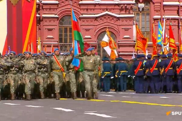 Foreign participants in the Victory Day parade march through Red Square Foreign participants in the Victory Day parade march through Red Square - Sputnik Africa