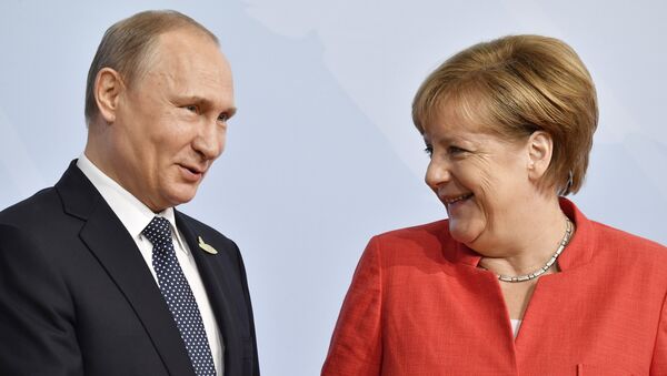 Poutine et Merkel - Sputnik Afrique