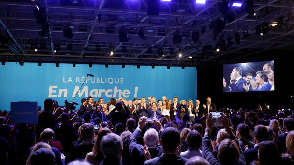 A close ally of French President Emmanuel Macron, Christophe Castaner, center, stands on the scene with his colleagues after being elected delegate general of French president's new centrist party, La Republique en Marche (The Republic on the Move, LREM), during a party convention in Chassieu, near Lyon, central France, Saturday, Nov. 18, 2017.  - Sputnik Afrique